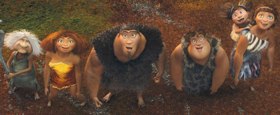 This film publicity image released by DreamWorks Animation shows, from left, Gran, voiced by Cloris Leachman, Eep, voiced by Emma Stone, Grug, voiced by Nicolas Cage, Thunk, voiced by Clark Duke, and Ugga, voiced by Catherine Keener, who is carrying Sandy, voiced by Randy Thom, in a scene from "The Croods." (AP Photo/DreamWorks Animation)