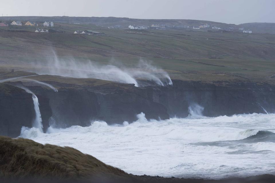 Water is blown back on to the land near Doolin, Co Clare, as Storm Eunice continues to rage across Ireland. More than 55,000 homes, farms and businesses were without power on the island on Friday morning, as the storm tracked eastwards across the Republic. Counties Cork, Kerry and the south of the country have borne the brunt of the major storm so far, which brought high winds and snow to parts of the island. Picture date: Friday February 18, 2022.