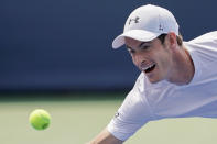 Andy Murray, of Great Britain, chases down a return from Lucas Pouille, of France, in the first round at the Western & Southern Open, Monday, Aug. 13, 2018, in Mason, Ohio. (AP Photo/John Minchillo)