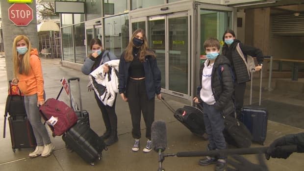 A group of travellers arrive from Quebec en route to Whistler, B.C. Sunday Feb. 28, 2021. (Cory Correia/CBC - image credit)