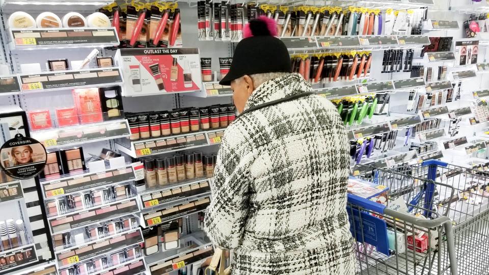 Columbus, Ohio December 5, 2019: Elderly lady shops in the cosmetic aisle at local Walmart.