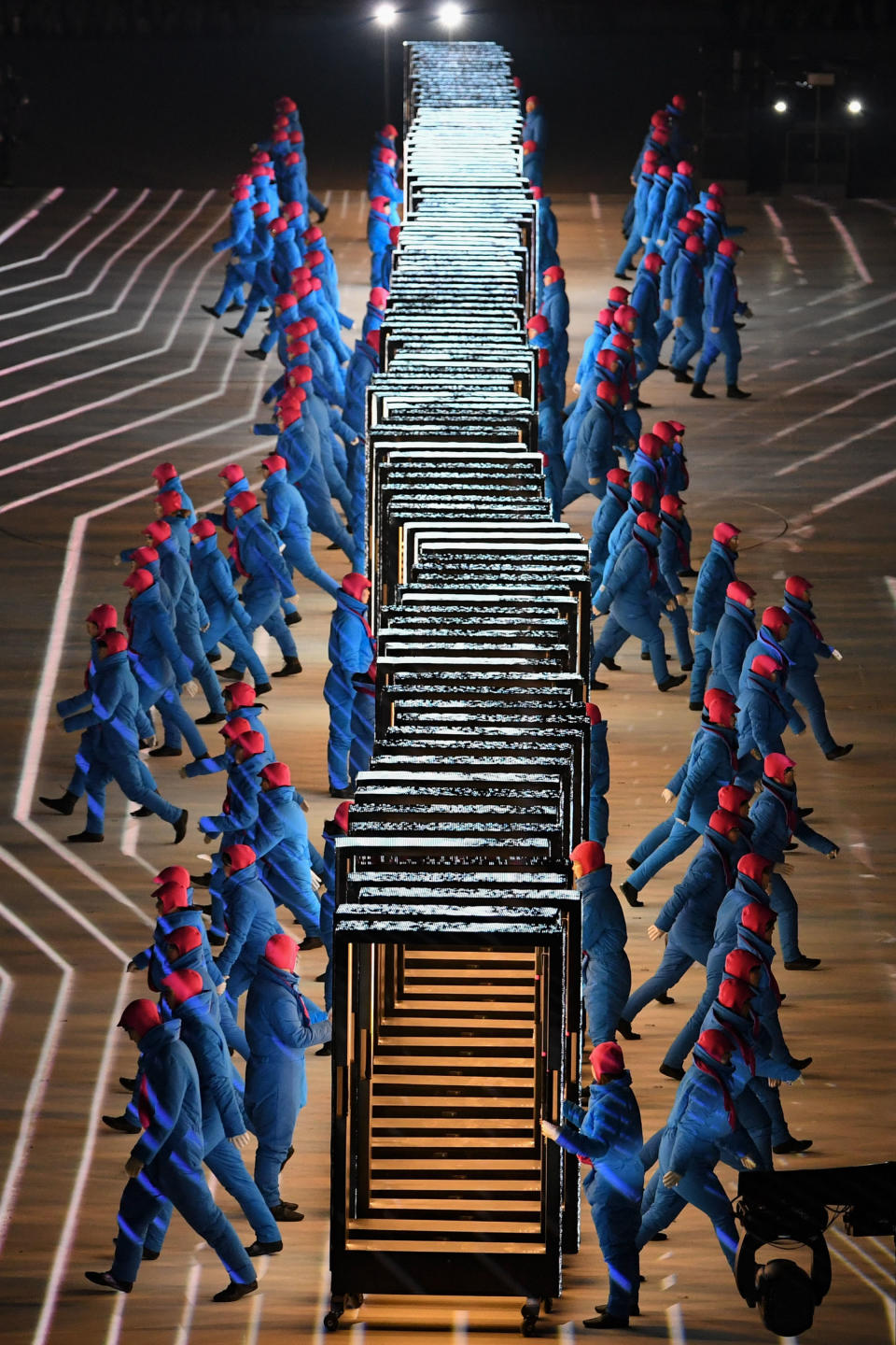 <p>Performer walk during the opening ceremony of the Pyeongchang 2018 Winter Olympic Games at the Pyeongchang Stadium on February 9, 2018. / AFP PHOTO / Martin BUREAU </p>