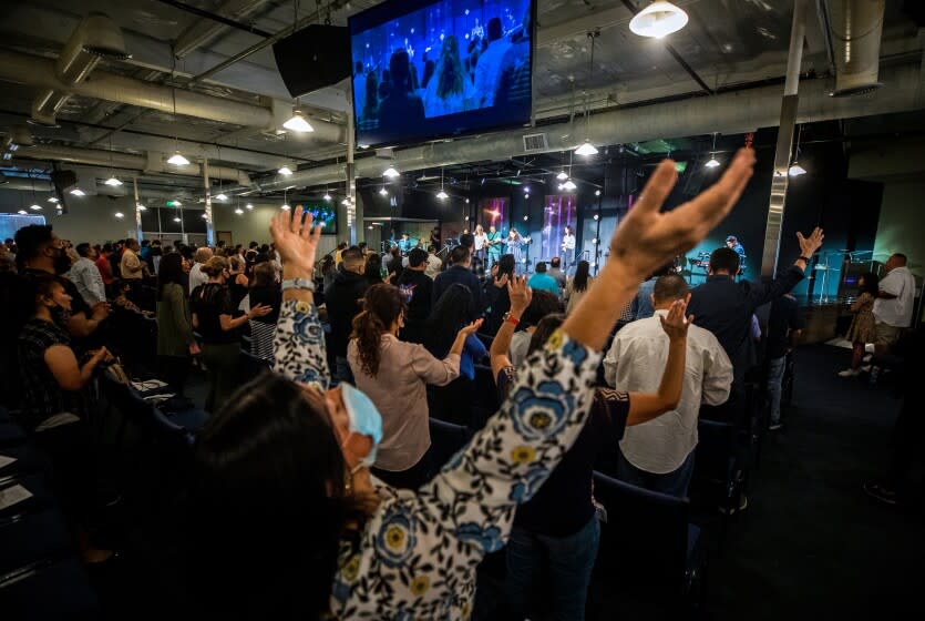 Parishioners attend service at Houses of Light Church on Sunday, Aug. 22, 2021 in Northridge, CA.