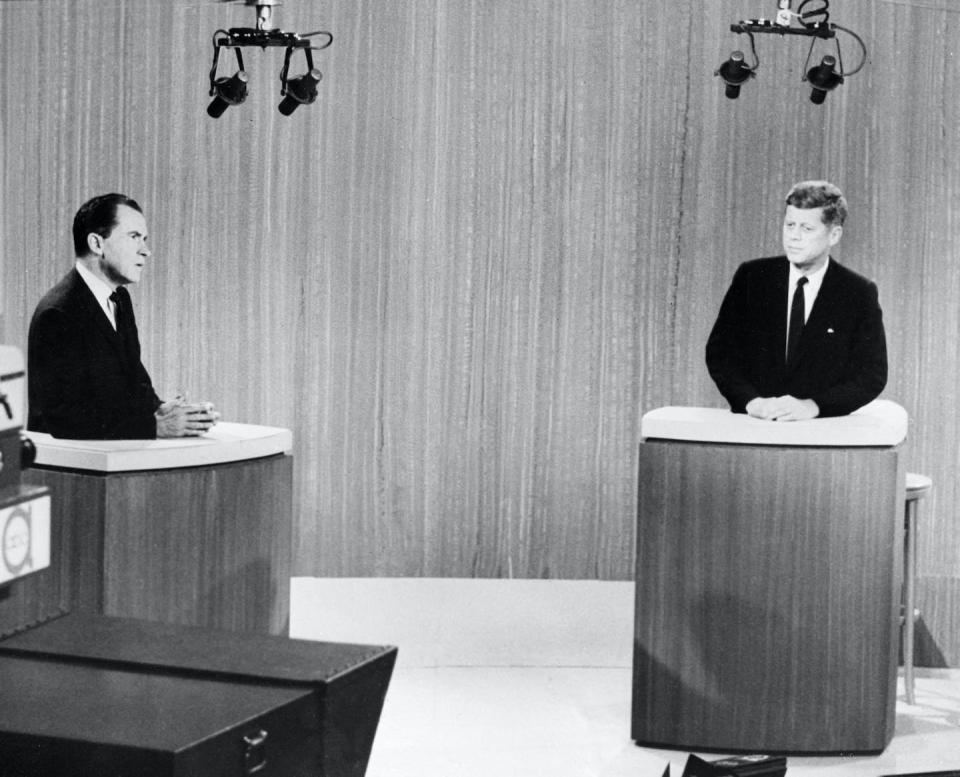 Vice President Richard Nixon, left, debates Senator John Kennedy in the first nationally televised debate between presidential candidates, in a Chicago television studio on Sept. 26, 1960. <a href="https://www.gettyimages.com/detail/news-photo/le-vice-président-richard-nixon-et-le-sénateur-john-kennedy-news-photo/1230343751?adppopup=true" rel="nofollow noopener" target="_blank" data-ylk="slk:AFP via Getty Images;elm:context_link;itc:0;sec:content-canvas" class="link ">AFP via Getty Images</a>