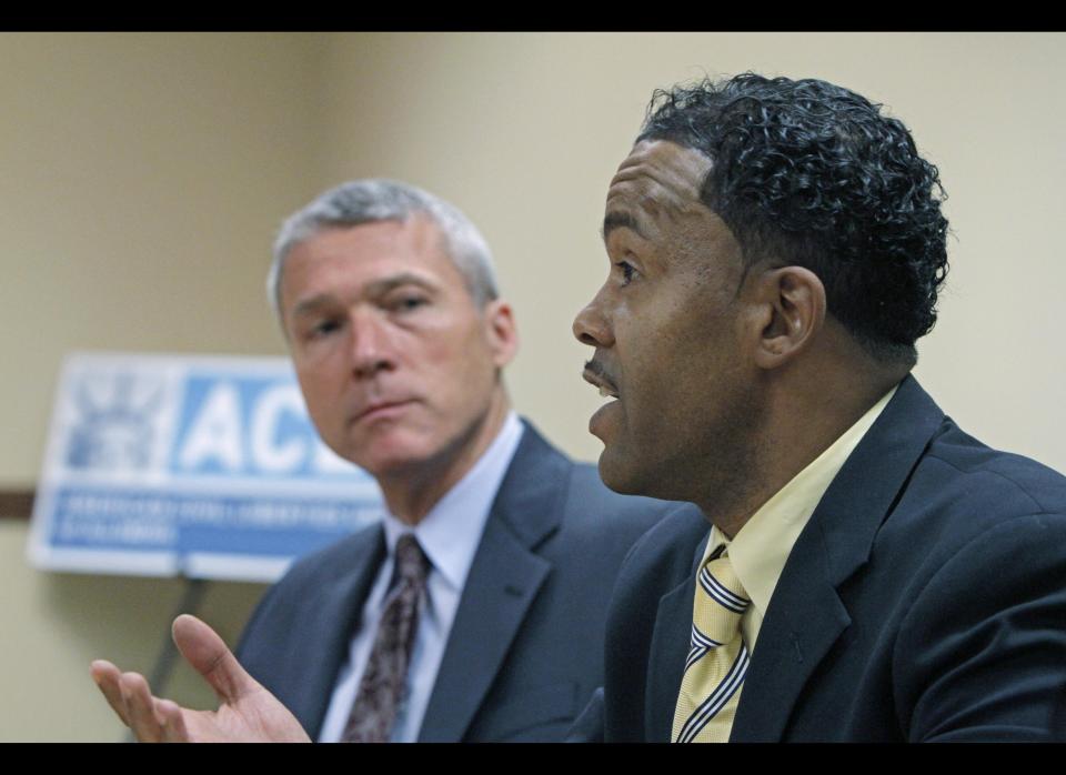 FILE - This Wednesday, June 22, 2011 file photo shows Chicago resident Arick Buckles, right, who is HIV positive, with ACLU attorney John Knight. Buckles filed a federal lawsuit Monday, June 18, 2012 claiming he was denied his prescribed medication for HIV for a week when he was an inmate in the Bureau County Jail in Princeton, Ill., in 2010, harming his health and violating his constitutional rights. The county was more worried about the cost of providing Buckles' HIV drugs than about his health, said American Civil Liberties Union attorney John Knight, who is helping represent Buckles. The drugs, a three-pill combination, cost more than $2,000 a month, according to Buckles' jail medical notes released to him by the county and shared by him with The Associated Press. (AP Photo/M. Spencer Green, File)