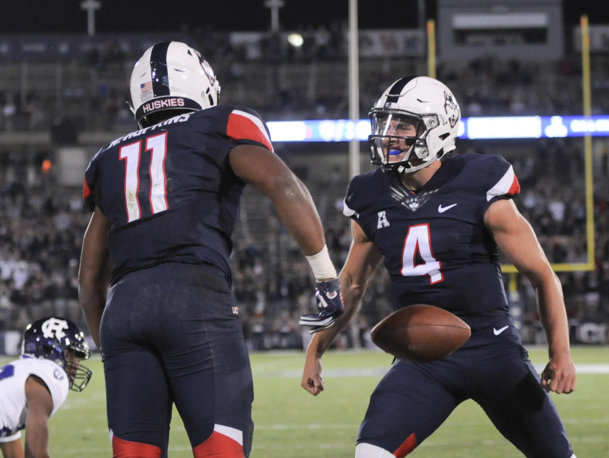 After trailing 20-7 at halftime, UConn came back to beat Holy Cross, 27-20. (AP Photo/Stephen Dunn)