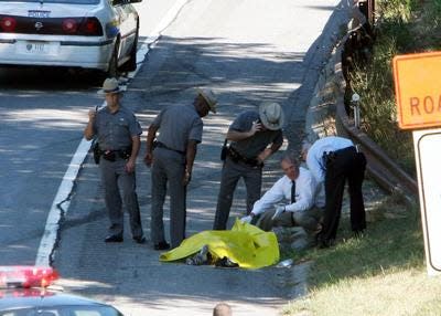 New York State Police investigate the scene on the side of the northbound Sprain Brook Parkway in Greenburgh on Sept. 3, 2005 where Angel Serbay’s body was found.