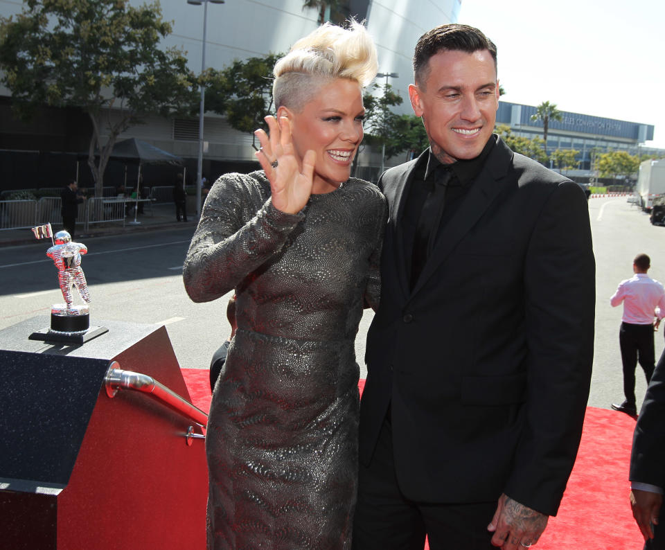 Pink, left, and Carey Hart arrive at the MTV Video Music Awards on Thursday, Sept. 6, 2012, in Los Angeles. (Photo by Matt Sayles/Invision/AP)