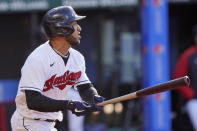 Cleveland Indians' Eddie Rosario watches his RBI double during the first inning of the team's baseball game against the Cincinnati Reds, Saturday, May 8, 2021, in Cleveland. (AP Photo/Tony Dejak)