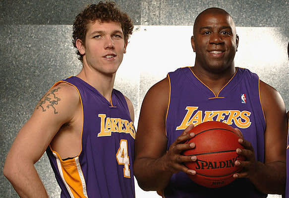 Lakers coach Luke Walton and team president Magic Johnson may not be on the same side for long. (Getty Images)