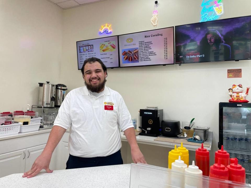 Tristin Sanders helps his mother, Giselle Sanders, operate Mochinut, a new gourmet doughnut store that has opened in Myrtle Beach. The store sells doughnuts that combine the Japanese-style mochi with the American-style doughnut. It also sells Korean corn dogs. 