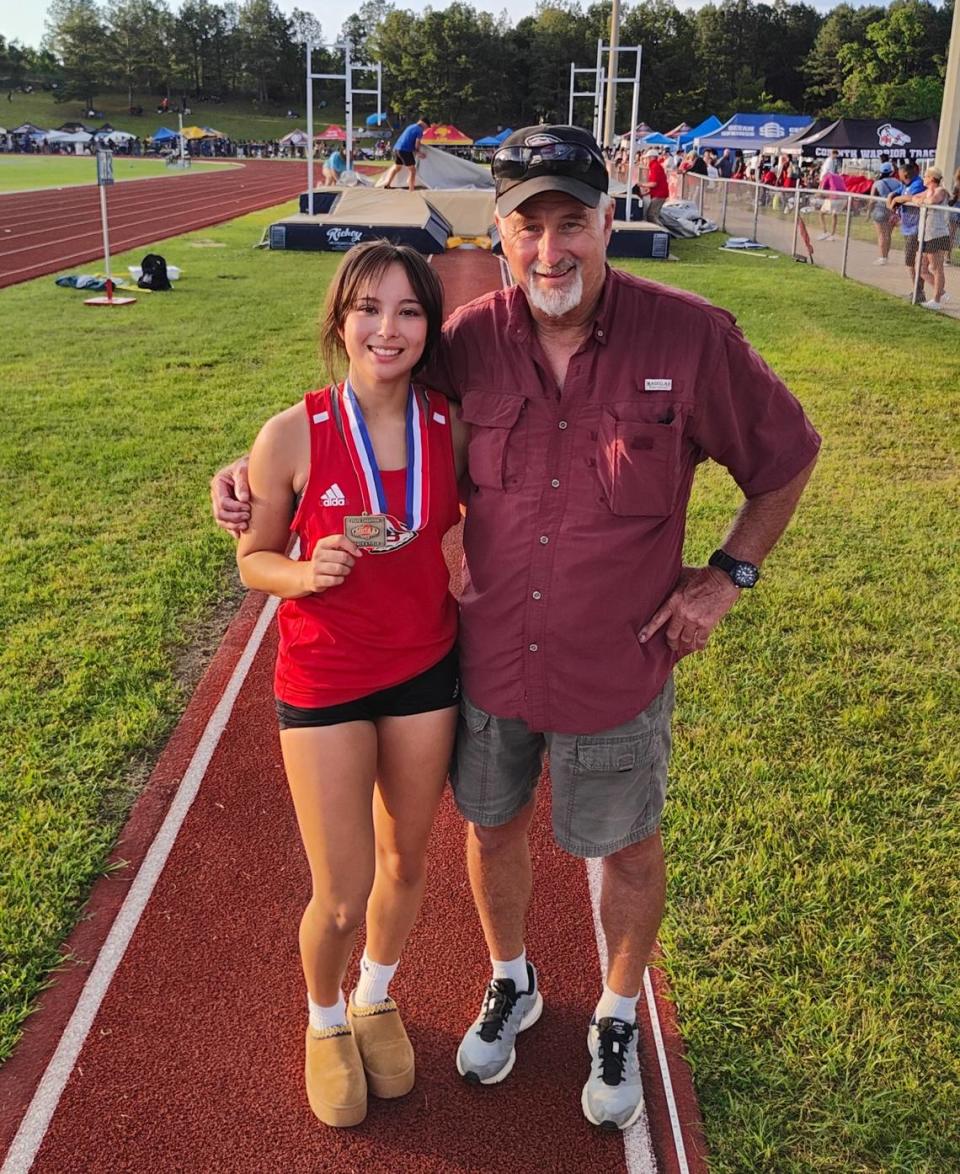 Julie Segroves with her father Jim Segroves at the Mississippi state track and field meet.