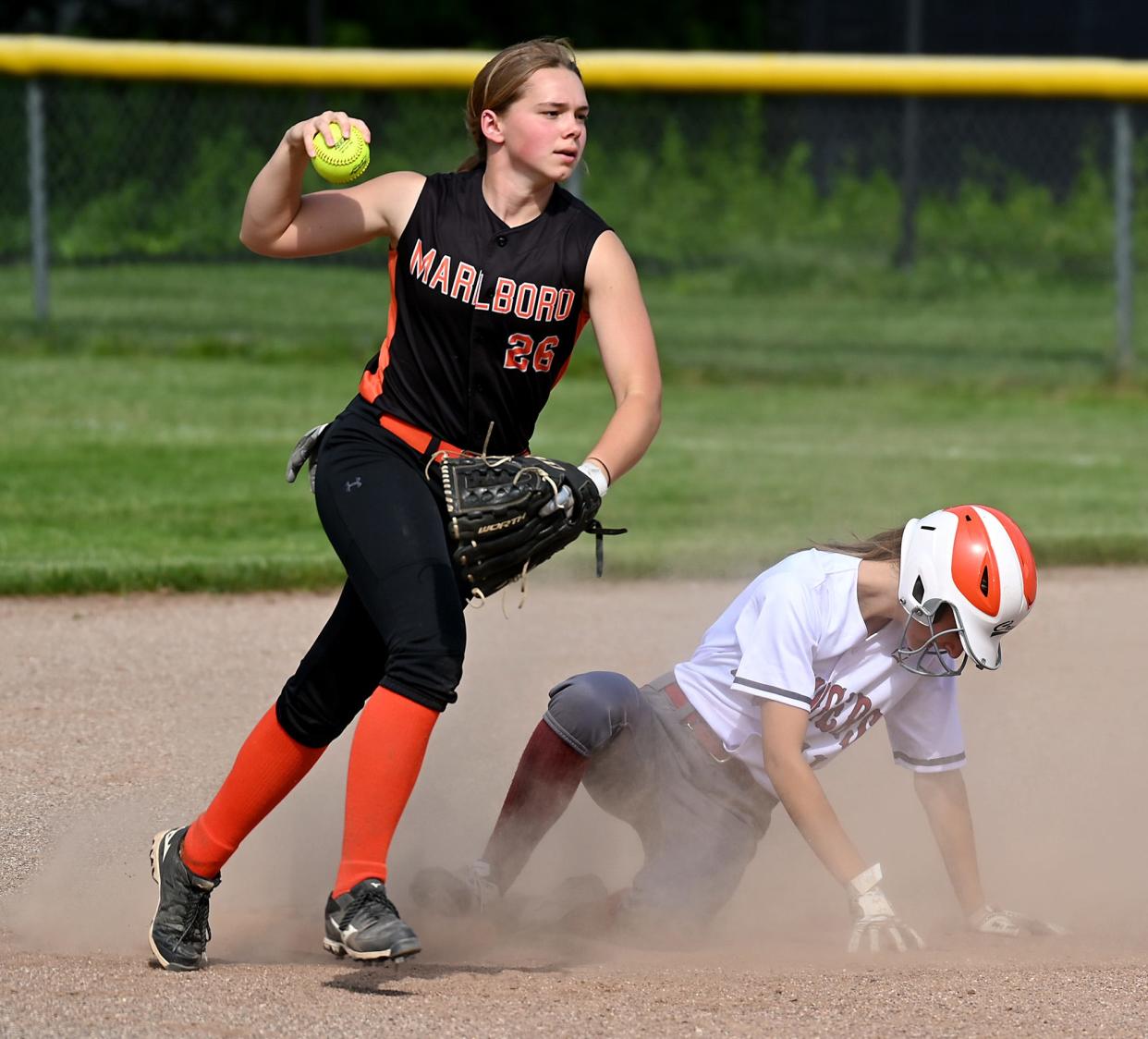 Marlborough shortstop Catherine Seay holds up the ball for the umpire after forcing out a Marlborough baserunner Wednesday at Westborough High School, June 2, 2021.  