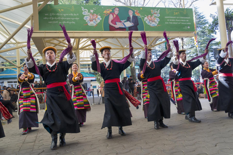 Exile Tibetan artists perform a traditional dance as they mark the anniversary of the awarding of the Nobel Peace Prize to their spiritual leader the Dalai Lama in Dharamshala, India, Sunday, Dec. 10, 2023. (AP Photo/Ashwini Bhatia)