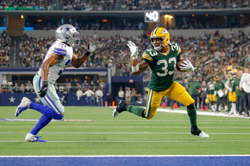 Green Bay Packers running back Aaron Jones was fined more than $10,000 for this wave. (Getty Images)