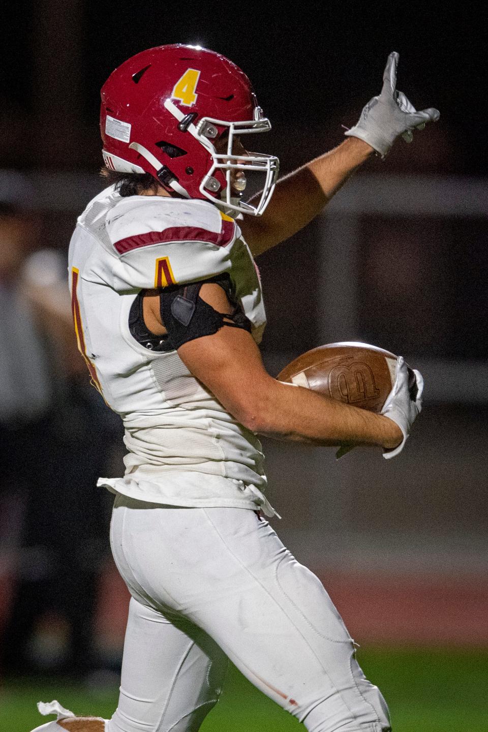 Rocky Mountain High School football running back Abe Chatila scores a touchdown against Fossil Ridge during their game at PSD Stadium in Timnath on Friday, Oct. 14, 2022.