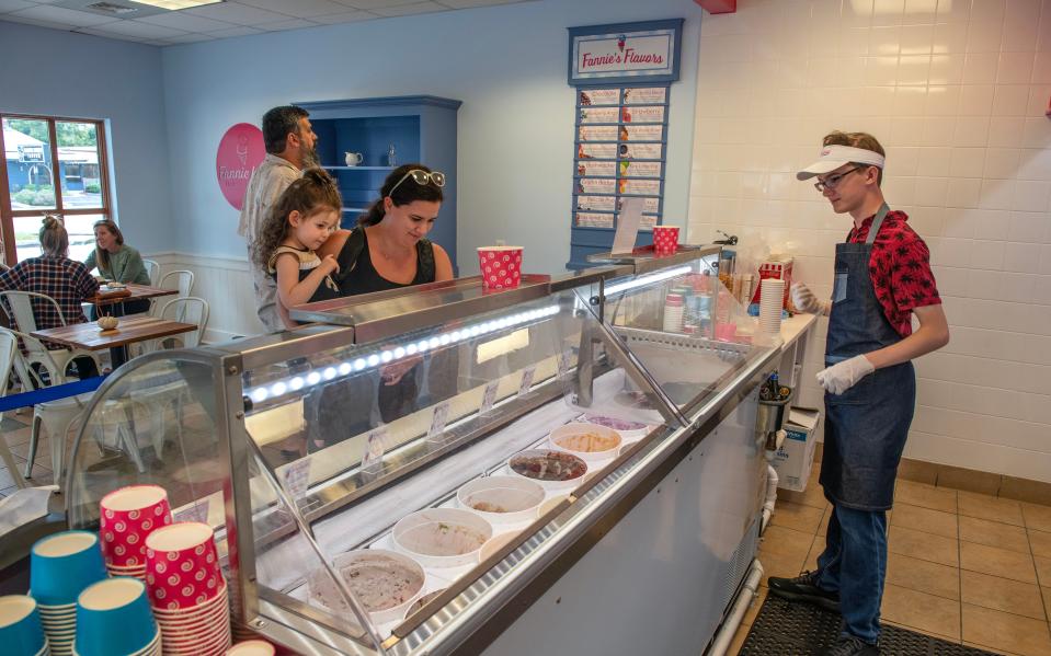 Matthew Miley of Fannie Lou's Ice Cream helps the Galvan family with their ice cream choice.