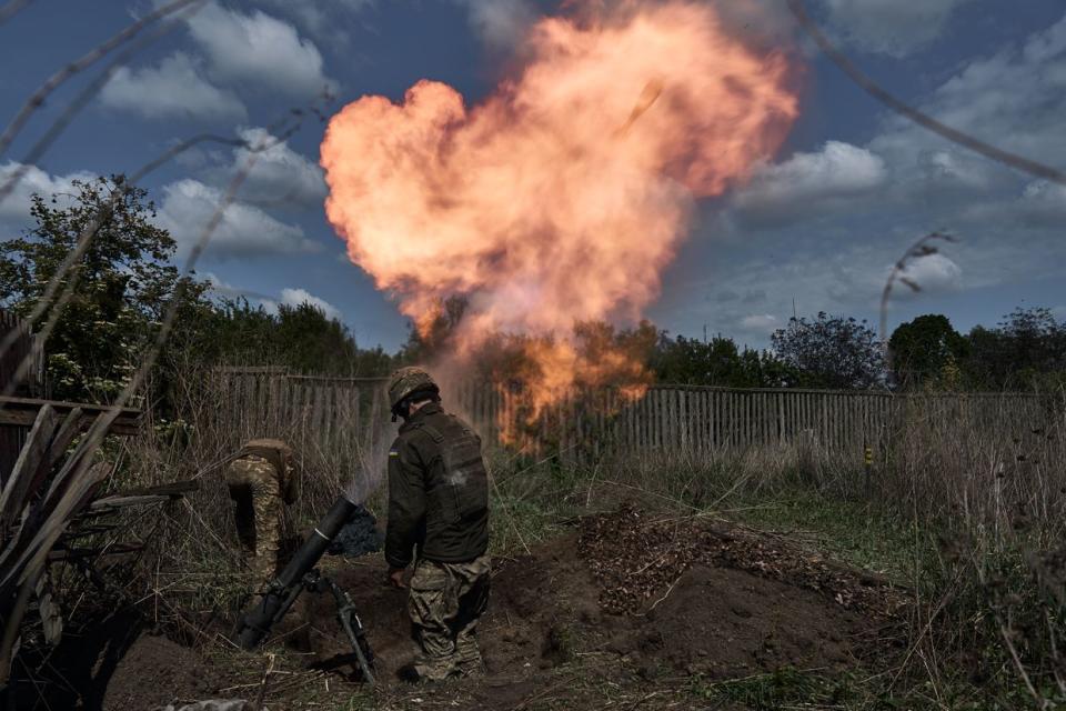 A mortar unit with a 120 mm mortar prepares to perform a combat mission in the Kharkiv region, Ukraine on May 18, 2024. Ukrainian soldiers from the 92nd assault brigade were involved in holding back the Russians on the border with Russia. In recent days Russian forces have gained ground around the Kharkiv region, which Ukraine had largely reclaimed in the months following Russia's initial large-scale invasion in February 2022. (Kostiantyn Liberov/Libkos/Getty Images)