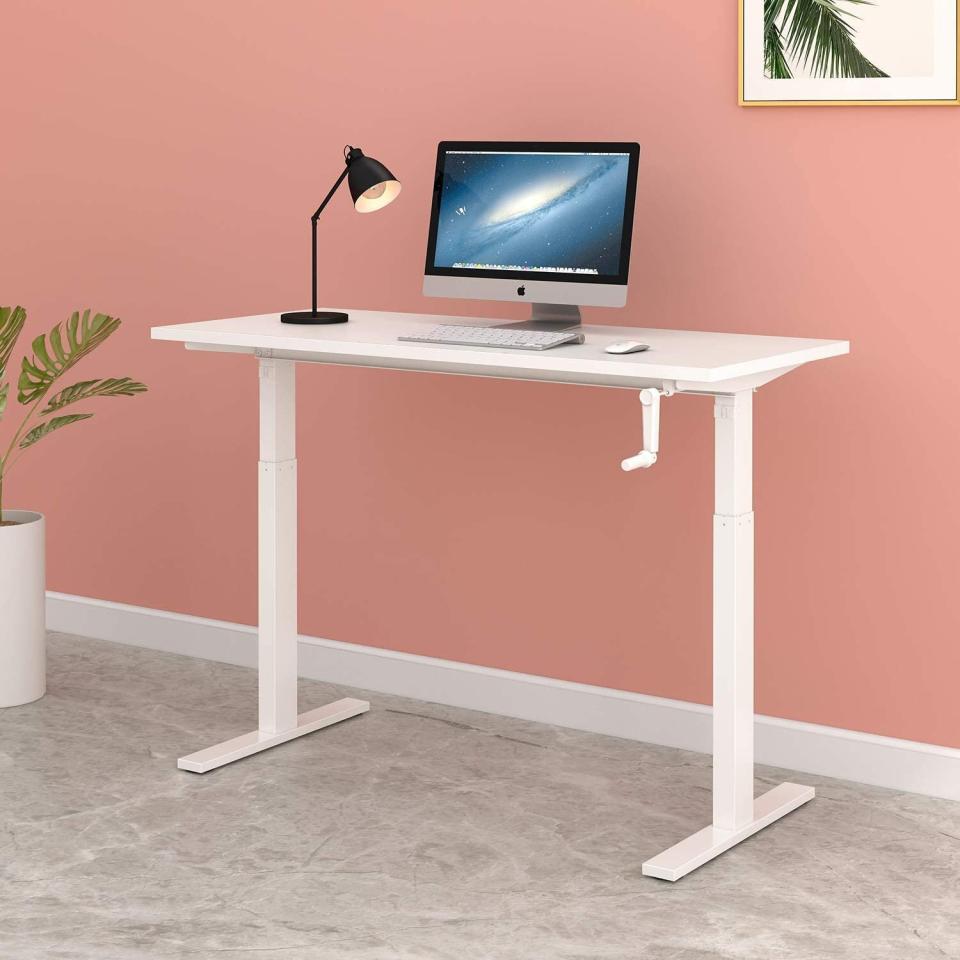 Find this <a href="https://amzn.to/2WSENeL" target="_blank" rel="noopener noreferrer">DEVAISE standing desk 55-inch adjustable height sit-to-stand desk work station</a> for $230 at <a href="https://amzn.to/2WSENeL" target="_blank" rel="noopener noreferrer">Amazon</a>. <br /><strong>Ratings</strong>: 4.2 stars<br /><strong>Reviews</strong>: More than 50