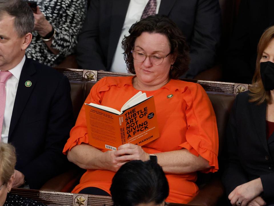 U.S. Rep.-elect Katie Porter (D-CA) reads a book in the House Chamber during the fourth day of elections for Speaker of the House at the U.S. Capitol Building on January 06, 2023 in Washington, DC.