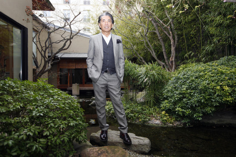 FILE - In this Tuesday, March 24, 2009 file photo, Japanese fashion designer Kenzo Takada poses outside his Paris house. Fashion designer Kenzo Takada dies from COVID-19 complications at age 81 near Paris, spokeswoman and reports said Sunday Oct. 4, 2020. (AP Photo/Jacques Brinon, file)