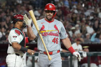 St. Louis Cardinals' Paul Goldschmidt flips his bat in the air after striking out against the Arizona Diamondbacks during the first inning of a baseball game Friday, April 12, 2024, in Phoenix. (AP Photo/Ross D. Franklin)