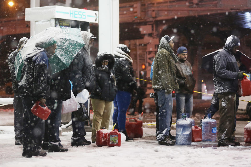 People wait on line to buy gasoline during a Nor?Easter snowstorm on November 7, 2012 in the Brooklyn borough of New York City. The city is still experiencing long gas lines in the wake of Superstorm Sandy. (Photo by Mario Tama/Getty Images)