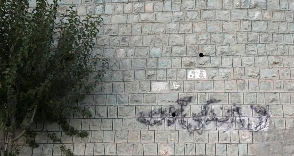 A graffiti that reads in Farsi ‘Woman, Life, Freedom’ the key slogan of anti-government protests after the death of 22-year-old woman Mahsa Amini in the September of 2022 (AP)