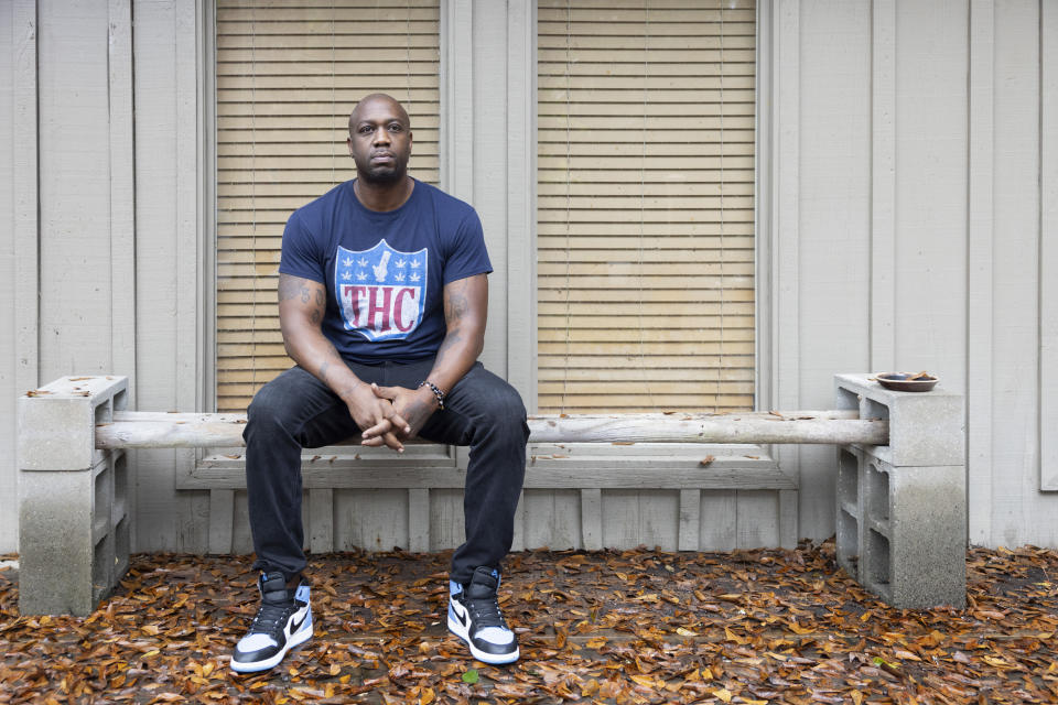 Former NFL player Boo Williams poses for a portrait outside of his home in Picayune, Miss., Wednesday, Nov. 15, 2023. Williams needs surgery, medicine and doctors to make the pain subside from injuries he endured during his football career. But he can't afford any of it. The 44-year-old was recently awarded $5,000 a month by the NFL's disability benefit plan. But Williams said the plan and the league have repeatedly mishandled his claims and should really have paid him $500,000 or more over the past 14 years. (AP Photo/Christiana Botic)