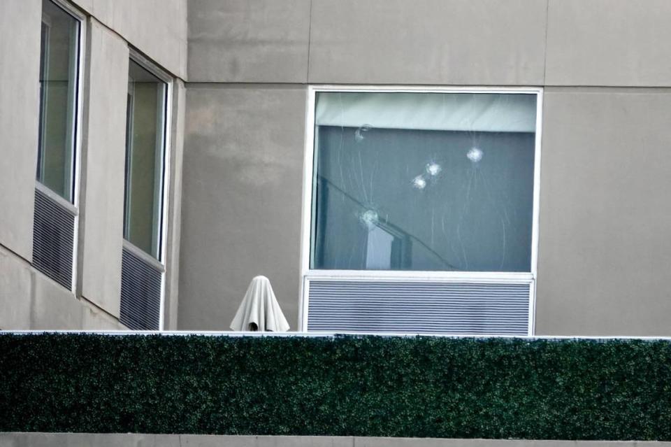 A Fort Lauderdale police officer was shot near the Holiday Inn Express Fort Lauderdale Cruise Airport on Southeast 17th Street on Thursday morning, March 21, 2024. Bullet holes can be seen in the window above the pool deck at the hotel. (Joe Cavaretta/South Florida Sun Sentinel)