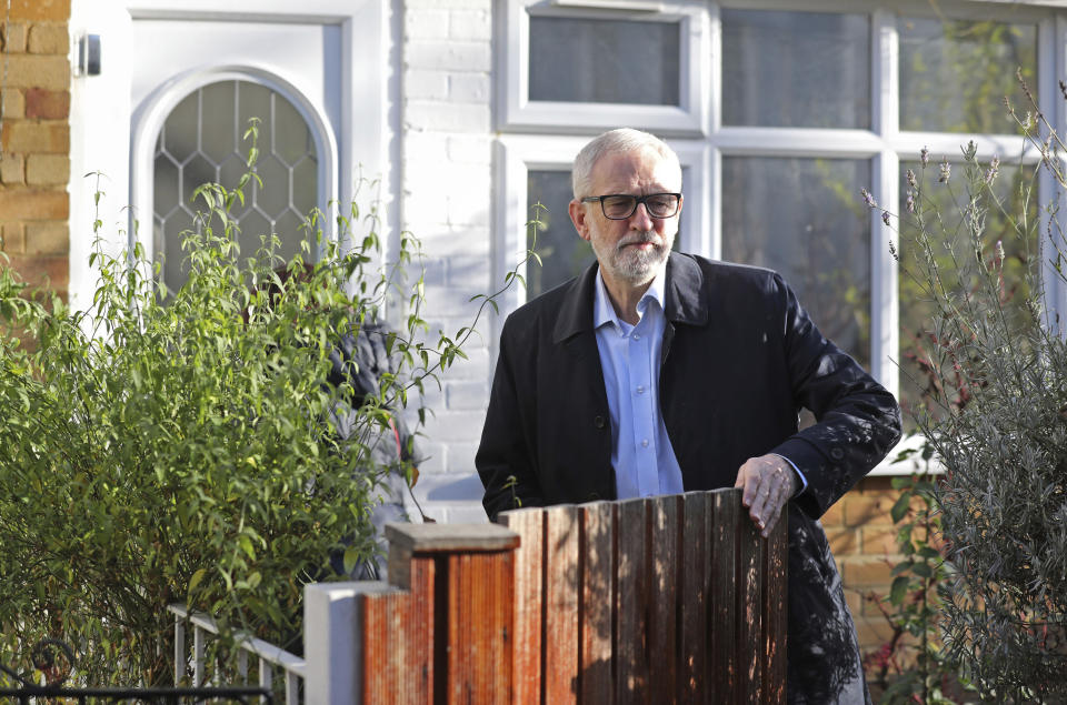 Leader of Britain's main opposition Labour Party, Jeremy Corbyn leaves his home in north London, Saturday Dec. 14, 2019. Corbyn has pledged to stand down from the party leadership following the collapse of the party vote in the recent general election and is under fire from within his own party. (Isabel Infantes/PA via AP)