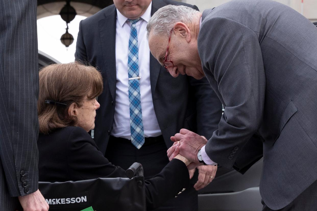 Democratic Senator from California Dianne Feinstein is greeted by Senate Majority Leader Chuck Schumer on 10 May 2023 (EPA)