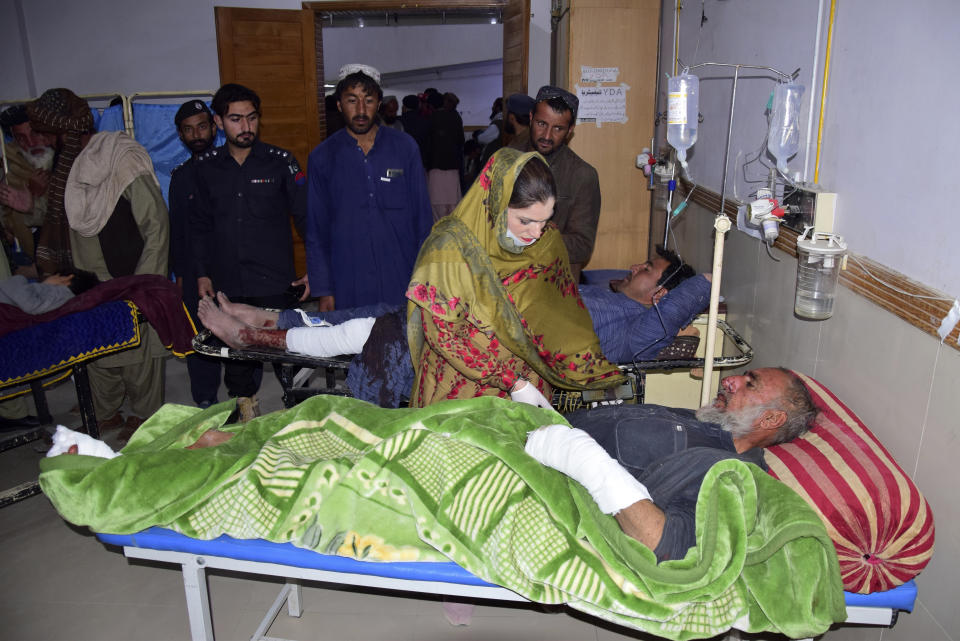 People, who were injured in the Afghan forces shelling, are treated in a hospital, in Quetta, Pakistan, Sunday, Dec. 11, 2022. Pakistan's army says deadly shelling from Afghan forces has killed some people in a border town. The violence hitting southwestern Pakistan's town of Chaman was the latest in a series of deadly incidents and attacks that have skyrocketed tensions with Afghanistan's Taliban rulers. (AP Photo/Arshad Butt)