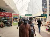 People wear protective face masks, following the outbreak of the new coronavirus, as they walk at Dragon Mart, a Chinese themed discount shopping centre, in Dubai