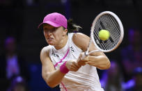 Poland's Iga Swiatek in action during the women's singles semifinal match against Kazakhstan's Elena Rybakina at the WTA Tour in Stuttgart, Germany, Saturday April 20, 2024. (Marijan Murat/dpa via AP)