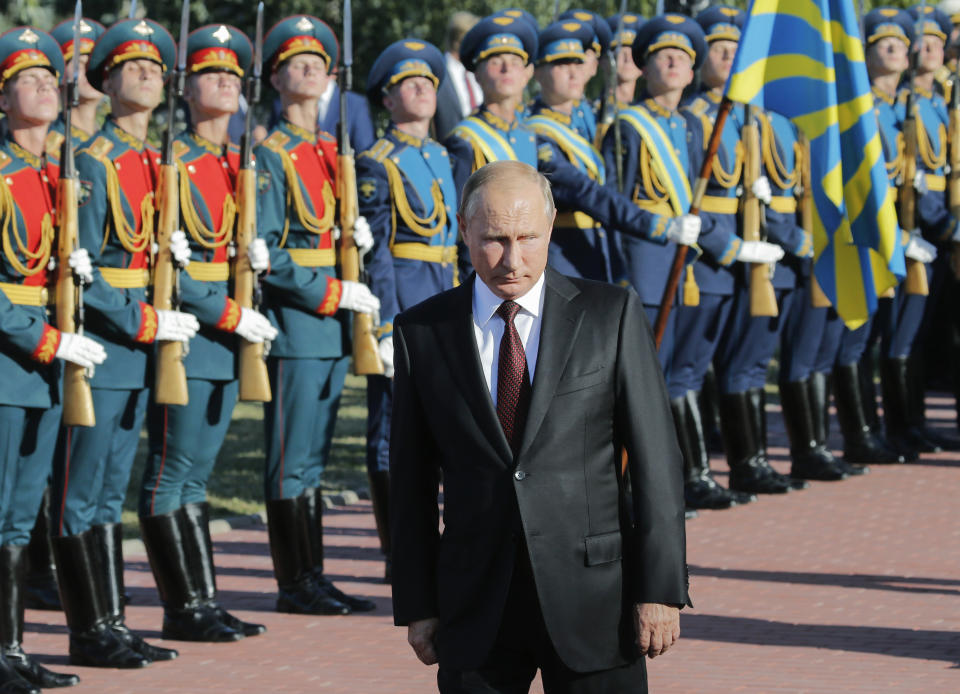 Russian President Vladimir Putin attends a laying ceremony in Kursk, 426 kilometers (266 miles) south of Moscow, Russia, Thursday, Aug. 23, 2018. Putin attended a ceremony marking the 75th anniversary of the battle of Kursk in which the Soviet army routed Nazi troops. It is described by historians as the largest tank battle in history involving thousands of tanks. (AP Photo/Alexander Zemlianichenko, Pool)