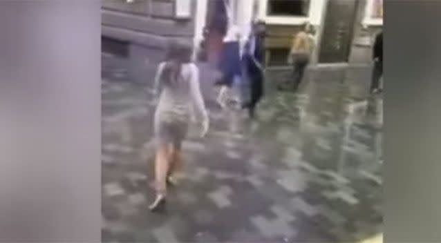 Following the punch the woman, seemingly stunned by the assault, walks away. Source: Twitter