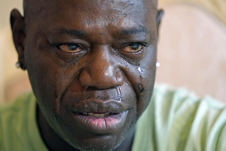 FIILE - Aaron Larry Bowman cries during an interview at his attorney's office in Monroe, La., Thursday, Aug. 5, 2021, as he discusses his injuries resulting from a Louisiana State trooper pummeling him with a flashlight during a traffic stop. A former Louisiana State Police trooper pleaded not guilty Wednesday, Oct. 13, 2021, to a federal charge in the 2019 video recorded beating of Bowman whose injuries included a broken jaw and broken ribs. Jacob Brown is charged with “deprivation of rights under color of law” in the beating of Bowman following a north Louisiana traffic stop. (AP Photo/Rogelio V. Solis, File)