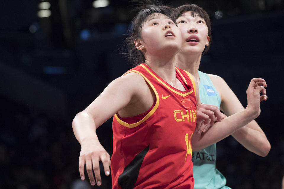 FILE - China center Li Yueru, front, vies for position against New York Liberty center Han Xu during a free throw in the first half of a WNBA exhibition basketball game Thursday, May 9, 2019, in New York. Han and Li are the latest of a half dozen Chinese players to have spent time in the WNBA. (AP Photo/Mary Altaffer, File)