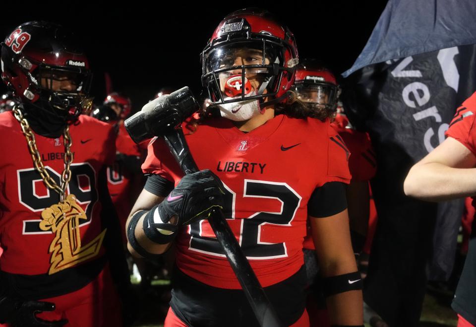 Liberty Lions linebacker Anthony Ruiz (22) takes the field with his teammates as they play the Sandra Day O'Connor Eagles during their open division playoff game on Friday, Nov. 25, 2022.