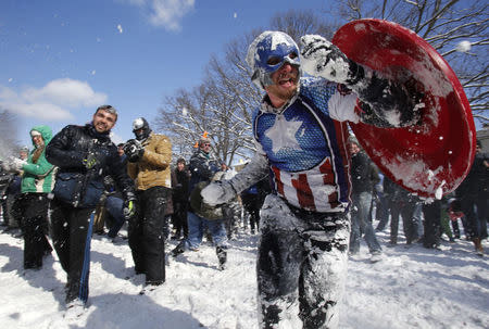 People participate in a massive snowball battle in the wake of winter storm Octavia at Meridian Park in Washington, D.C. February 17, 2015. REUTERS/Yuri Gripas