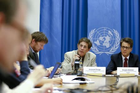 Armando Peruga (C), Programme Manager of Tobacco Free Initiative of the World Health Organization (WHO) and Douglas Bettcher (R), WHO's Director of the department for Prevention of Noncommunicable Diseases, speak during a press briefing at the United Nations in Geneva, August 26, 2014. REUTERS/Pierre Albouy