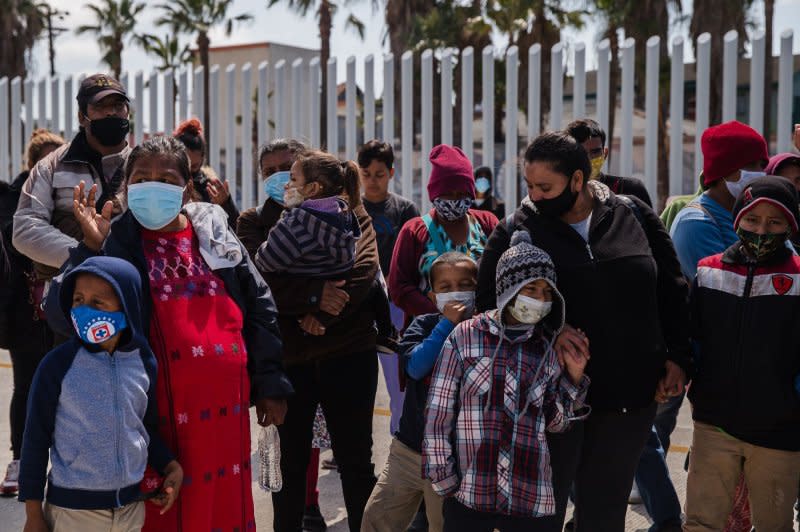 Asylum seekers demonstrate at the San Ysidro border crossing in Tijuana, Mexico, praying and listening to speeches on March 26, 2021. File Photo by Ariana Drehsler/UPI