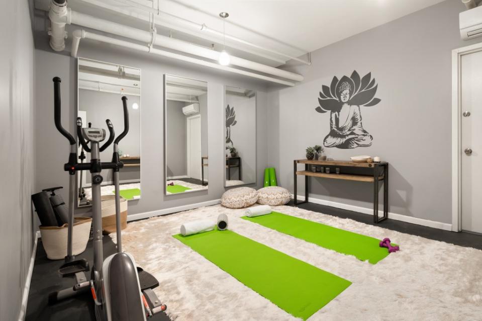 For now, the bachelor pad features a yoga area. Krisztina Crane from Evan Joseph Images