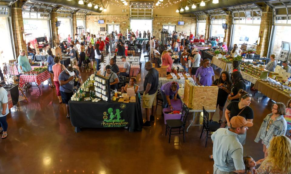 Aug 27, 2022; Tuscaloosa, AL, USA; Patrons shop at the Farmer's Market Saturday, Aug. 27, 2022, at the Tuscaloosa River Market. Mandatory Credit: Gary Cosby Jr.-Tuscaloosa News