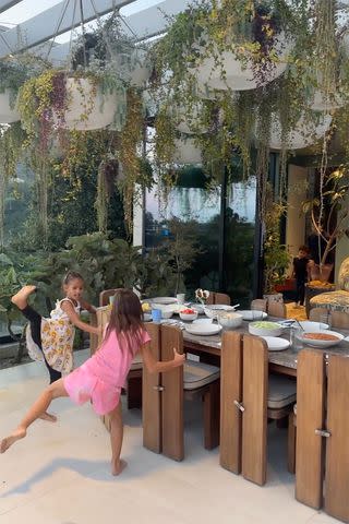 <p>Chrissy Teigen/Instagram</p> Chrissy Teigen's daughter Luna (and a friend) wait for dinner to be ready.
