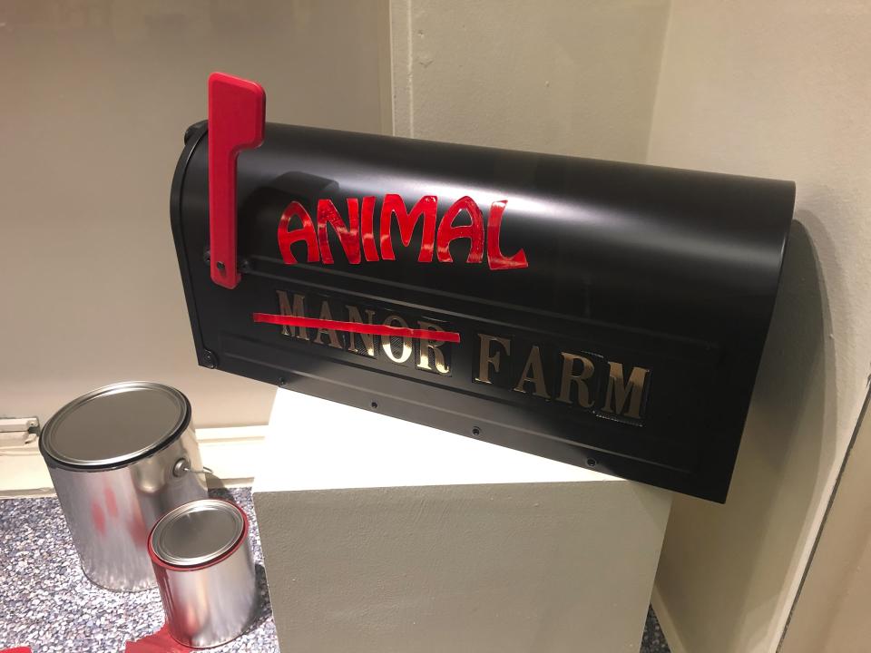 In this Oct. 23, 2019, photo, a piece of art promoting George Orwell's novel "Animal Farm" is shown at an exhibit in Albuquerque, N.M. celebrating the author's legacy. The exhibit at the University of New Mexico is tackling the themes of the novelist's work from "1984" to "Animal Farm." "George Orwell: His Enduring Legacy," which runs to April 2020, features posters and material related to work challenging totalitarianism. (AP Photo/Russell Contreras)