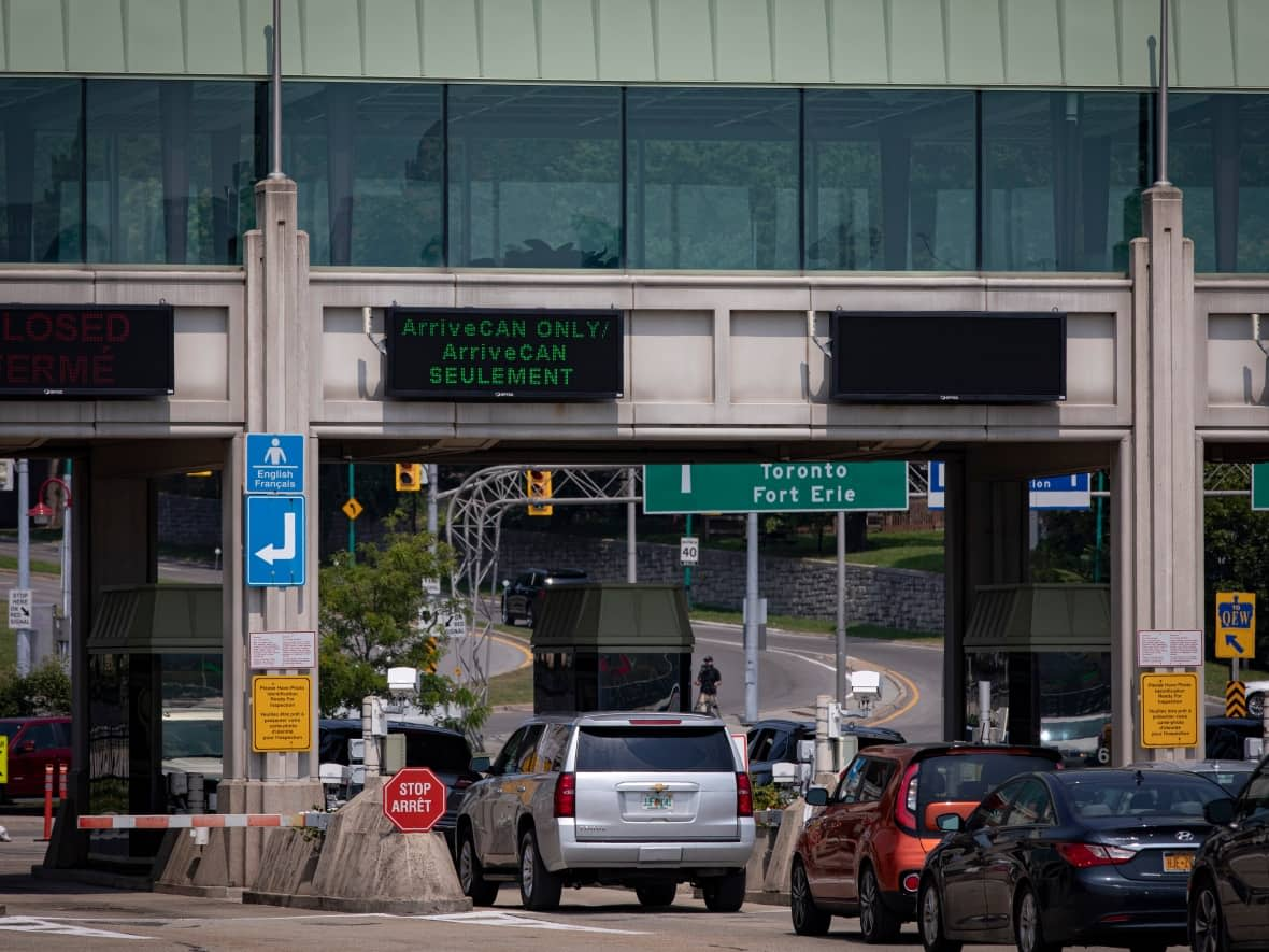 Cars bound for Canada line the Rainbow International Bridge, in Niagara Falls, on Aug. 9, 2021. Canada now allows fully vaccinated Americans to both enter the country and skip the previously mandatory 14-day quarantine period as part of an easing of COVID-19 restrictions on travel. (Evan Mitsui/CBC - image credit)