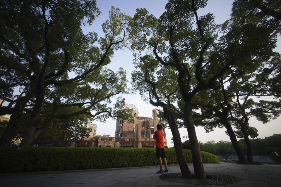 A man looks at the Atomic Bomb Dome in Hiroshima, western Japan, Sunday, Aug. 2, 2020. The city of Hiroshima on Thursday, Aug. 6 marks the 75th anniversary of the world’s first nuclear attack. (AP Photo/Eugene Hoshiko)