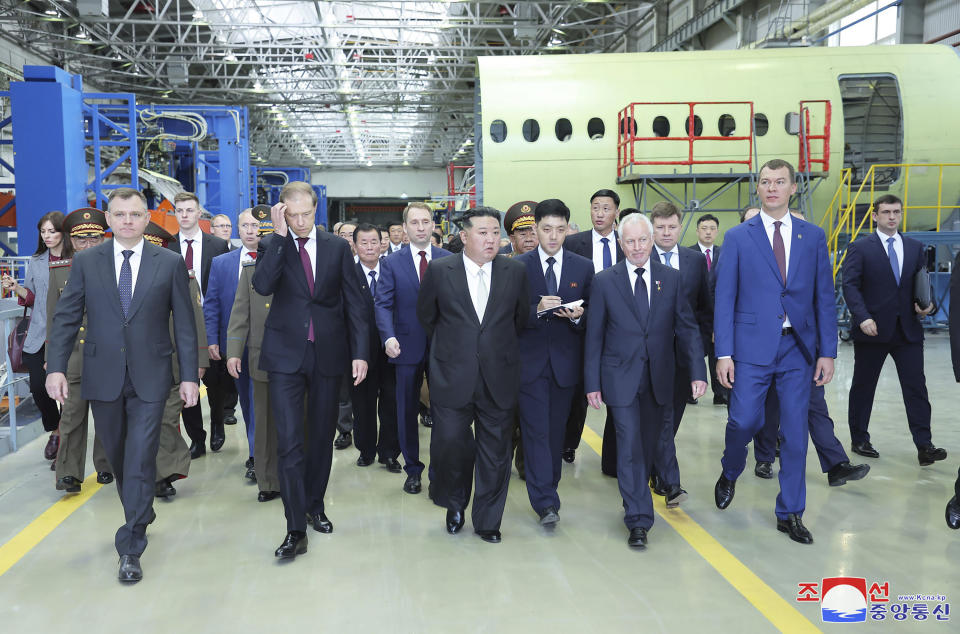 In this photo provided by the North Korean government, North Korean leader Kim Jong Un, center, visits a Russian aircraft plant that produces fighter jets in Komsomolsk-on-Amur, about 6,200 kilometers (3,900 miles) east of Moscow, Russia, Friday, Sept. 15, 2023. Independent journalists were not given access to cover the event depicted in this image distributed by the North Korean government. The content of this image is as provided and cannot be independently verified. Korean language watermark on image as provided by source reads: "KCNA" which is the abbreviation for Korean Central News Agency. (Korean Central News Agency/Korea News Service via AP)